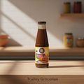 SBC Bagoong Balayan 340g bottle with Trolley Groceries branding below on a warm pantry background