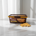 MY San Graham Crackers 800g tub on marble surface with crackers beside it