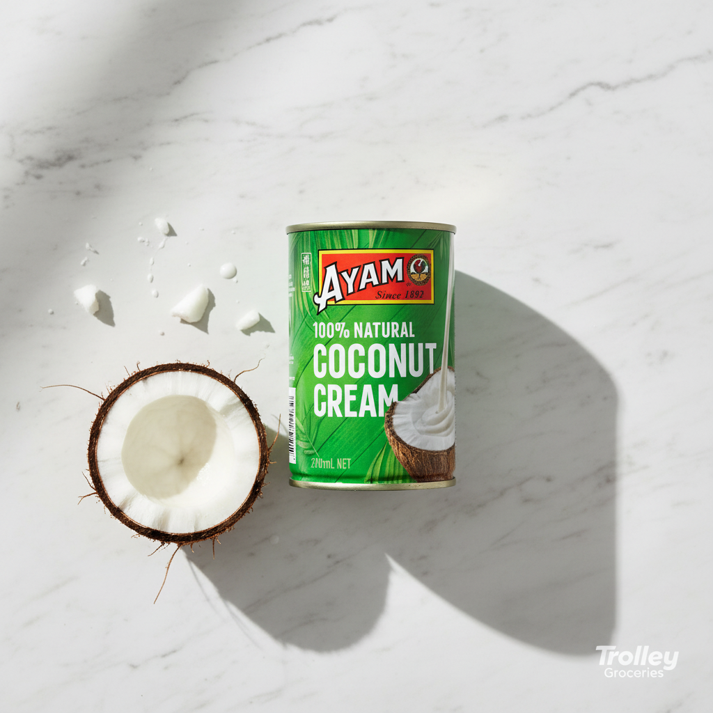 Ayam Coconut Cream 270ml green tin on marble surface with coconut